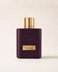 Flacone di Vino Rouge, profumo arabo Prima Chic, su fondo neutro
