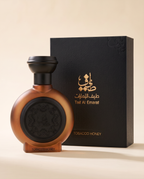 TOBACCO HONEY by Taif Al Emarat: bottle beside its presentation box, on a cream surface