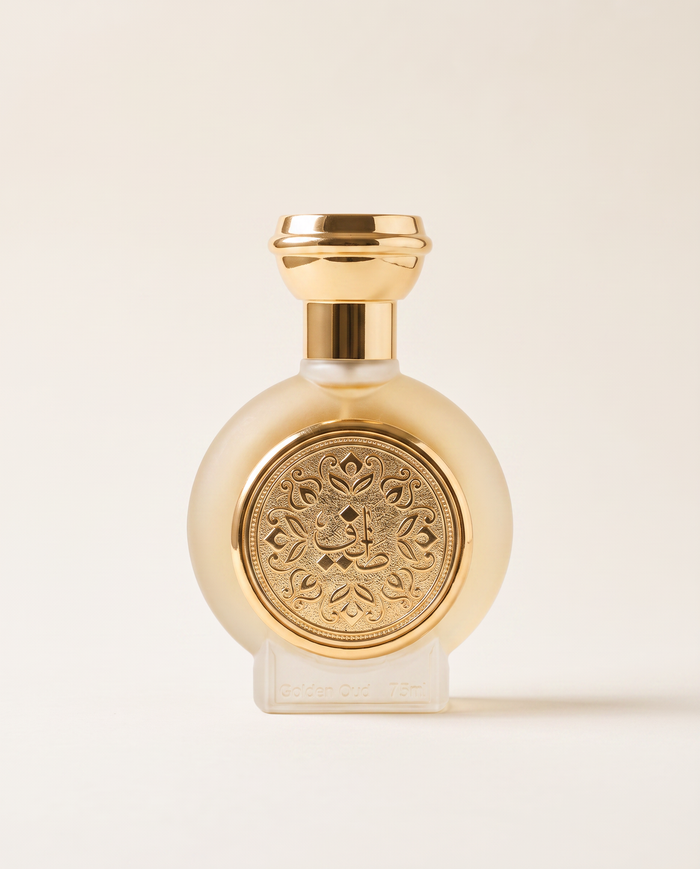 GOLDEN OUD by Taif Al Emarat, 75ml bottle with embossed gold medallion, on a plain cream background
